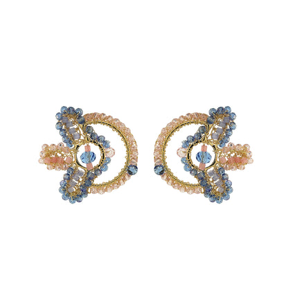 Pair of decorative earrings with gold and blue elements on a white background