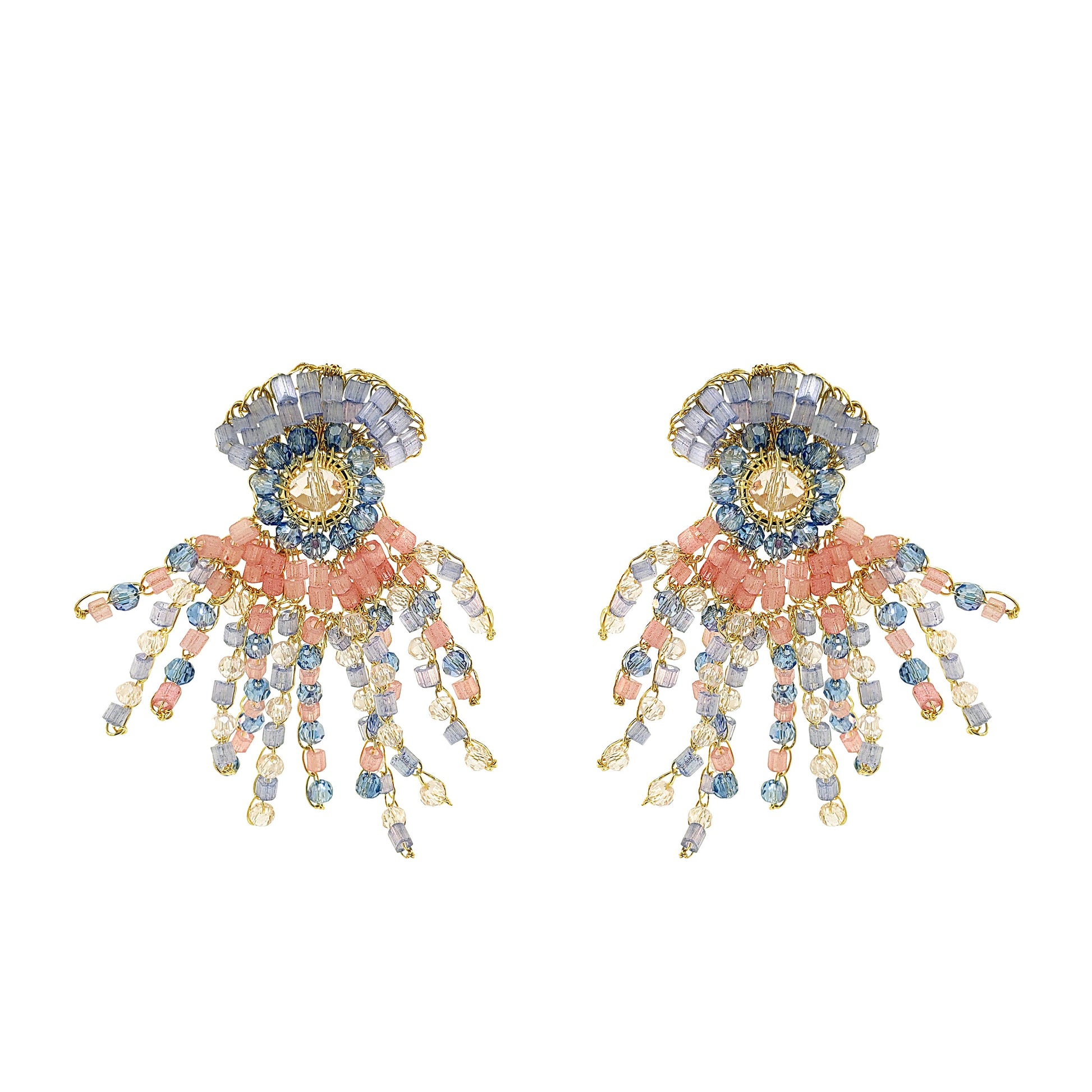 Pair of decorative earrings with floral and organic design and beads on a white background