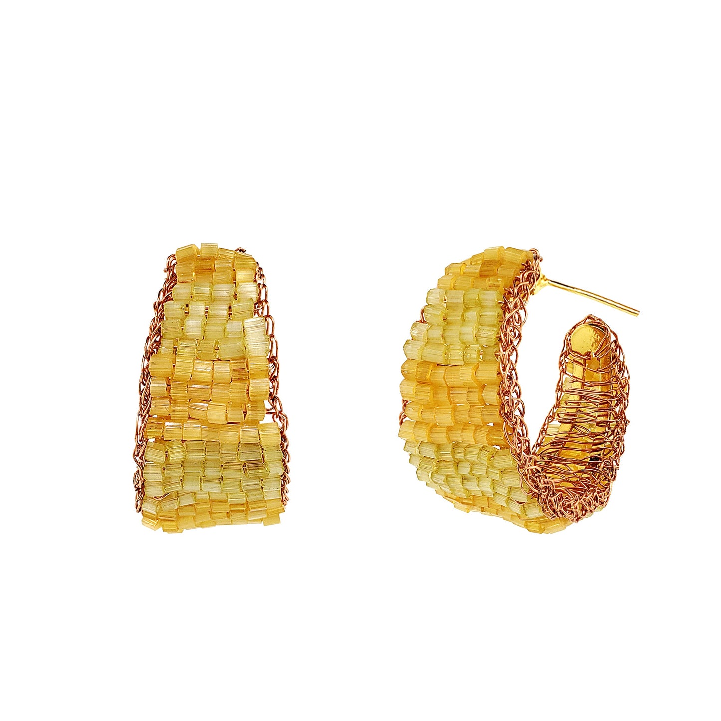 Pair of yellow hoop earrings on a white background