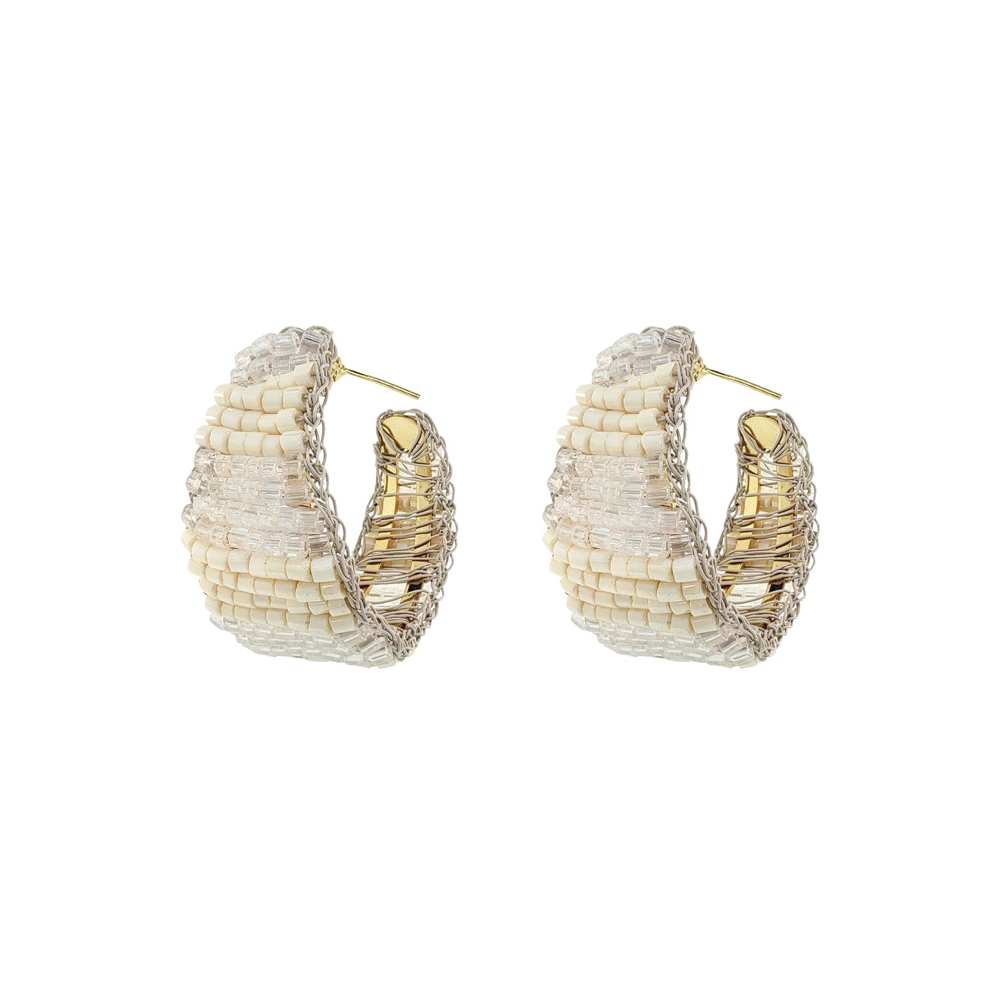 Pair of gold and white hoop earrings on a white background