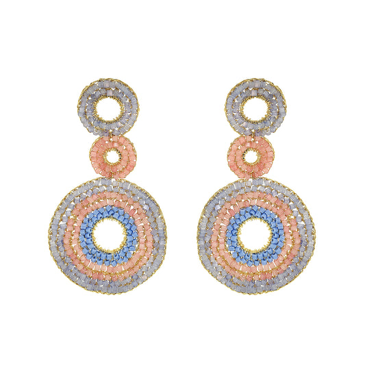 Pair of earrings with circular design on a white background