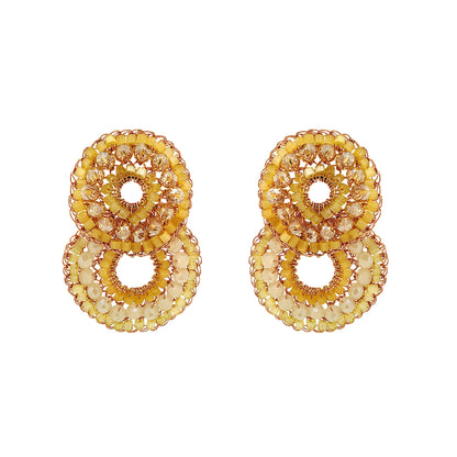 Pair of gold circular earrings on a white background