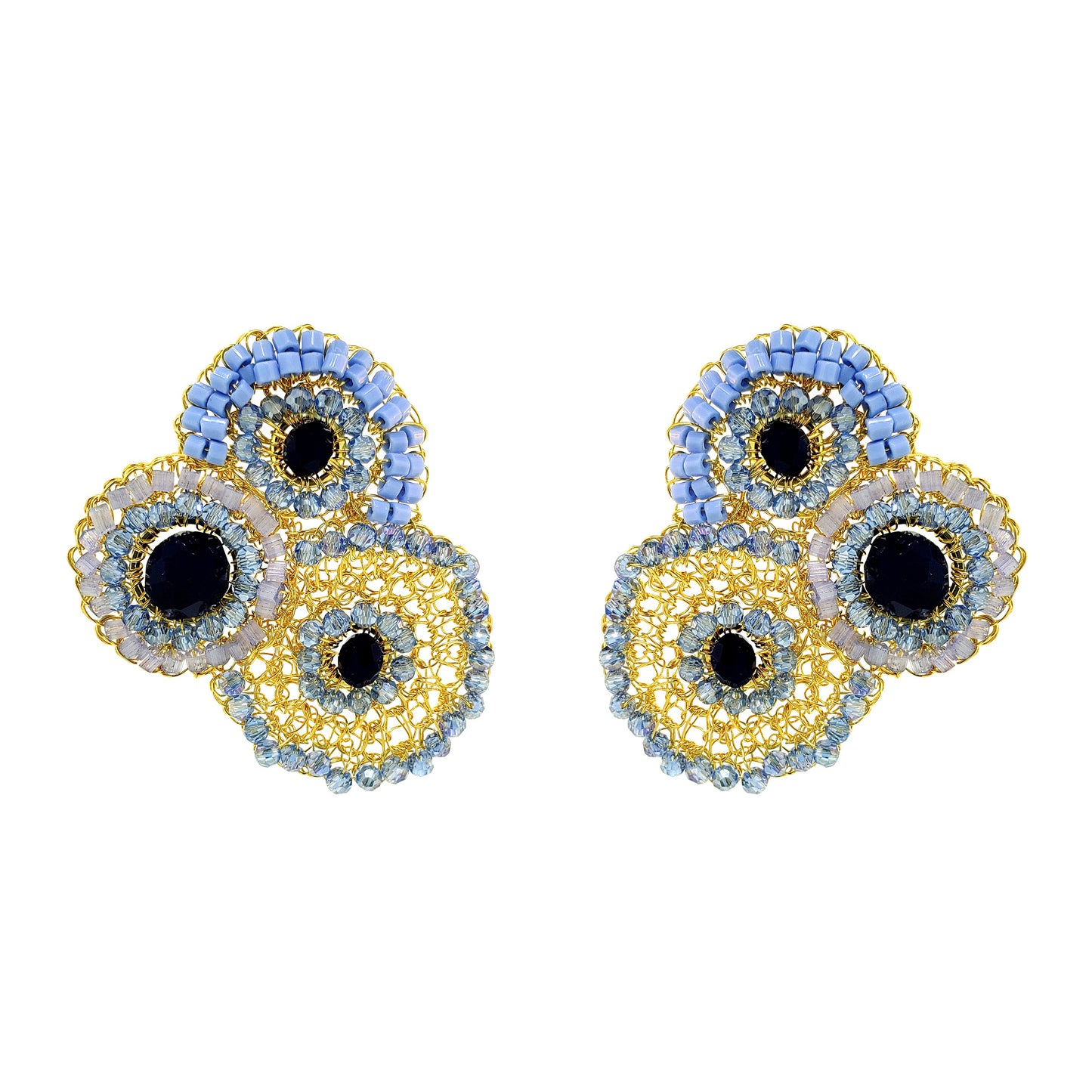 Pair of earrings with circular design on a white background