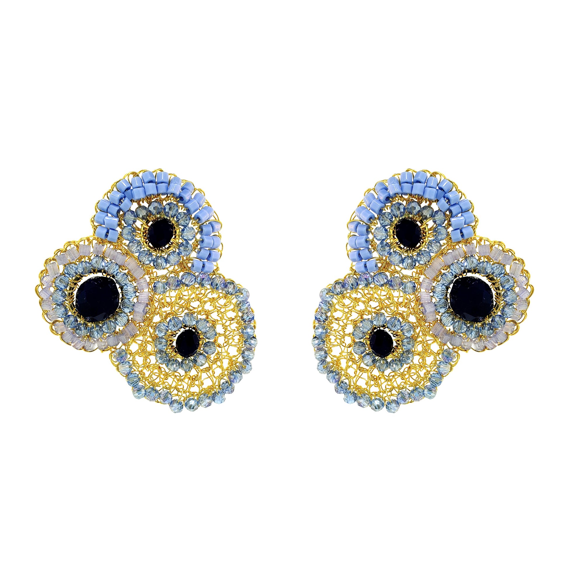 Pair of earrings with circular design on a white background