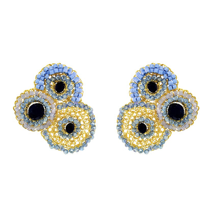 Pair of earrings with circular design on a white background