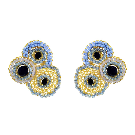 Pair of earrings with circular design on a white background