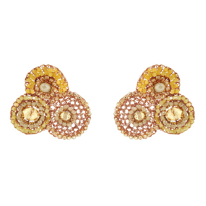 Pair of gold and rose gold earrings with circular designs on a white background