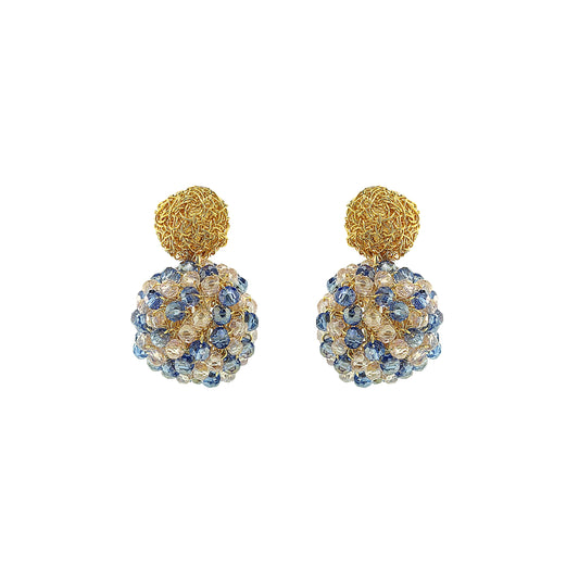 Pair of gold and blue spherical earrings on a white background
