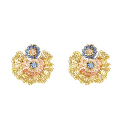 Pair of gold floral earrings with colorful stones on a white background
