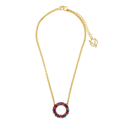 A gold-colored necklace with a round fuchsia, blue, and yellow hand-crocheted pendant and an 18 karat gold filled chain.