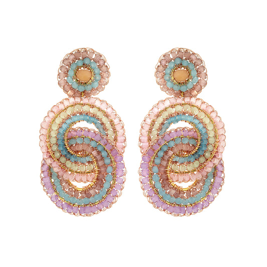 Pair of beaded earrings with pastel colors on a white background