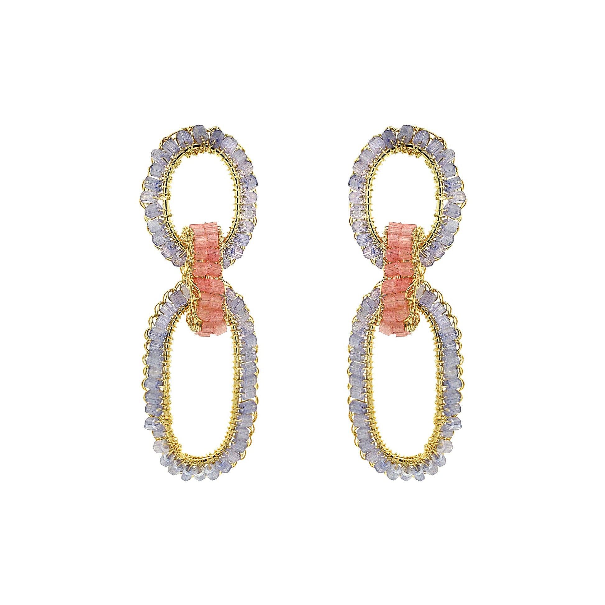 Pair of earrings with gold and silver loops on a white background