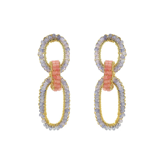 Pair of earrings with gold and silver loops on a white background