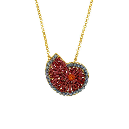 Gold necklace with a heart-shaped pendant on a white background