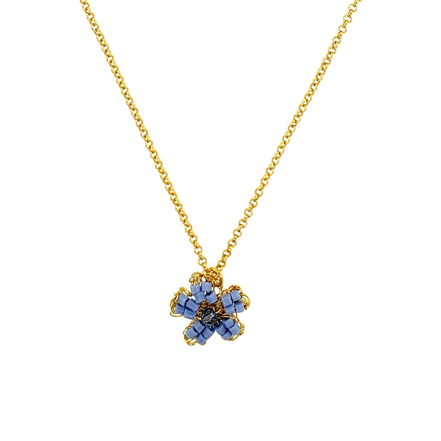 Gold necklace with a floral pendant on a white background