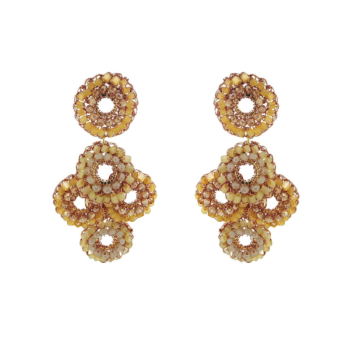 Pair of gold beaded earrings on a white background
