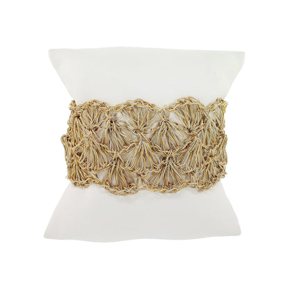 Decorative pillow with gold woven pattern on a white background