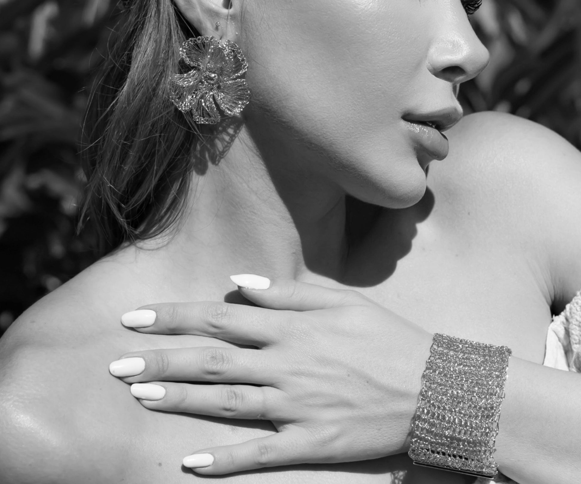Close-up of a woman wearing jewelry with a blurred background
