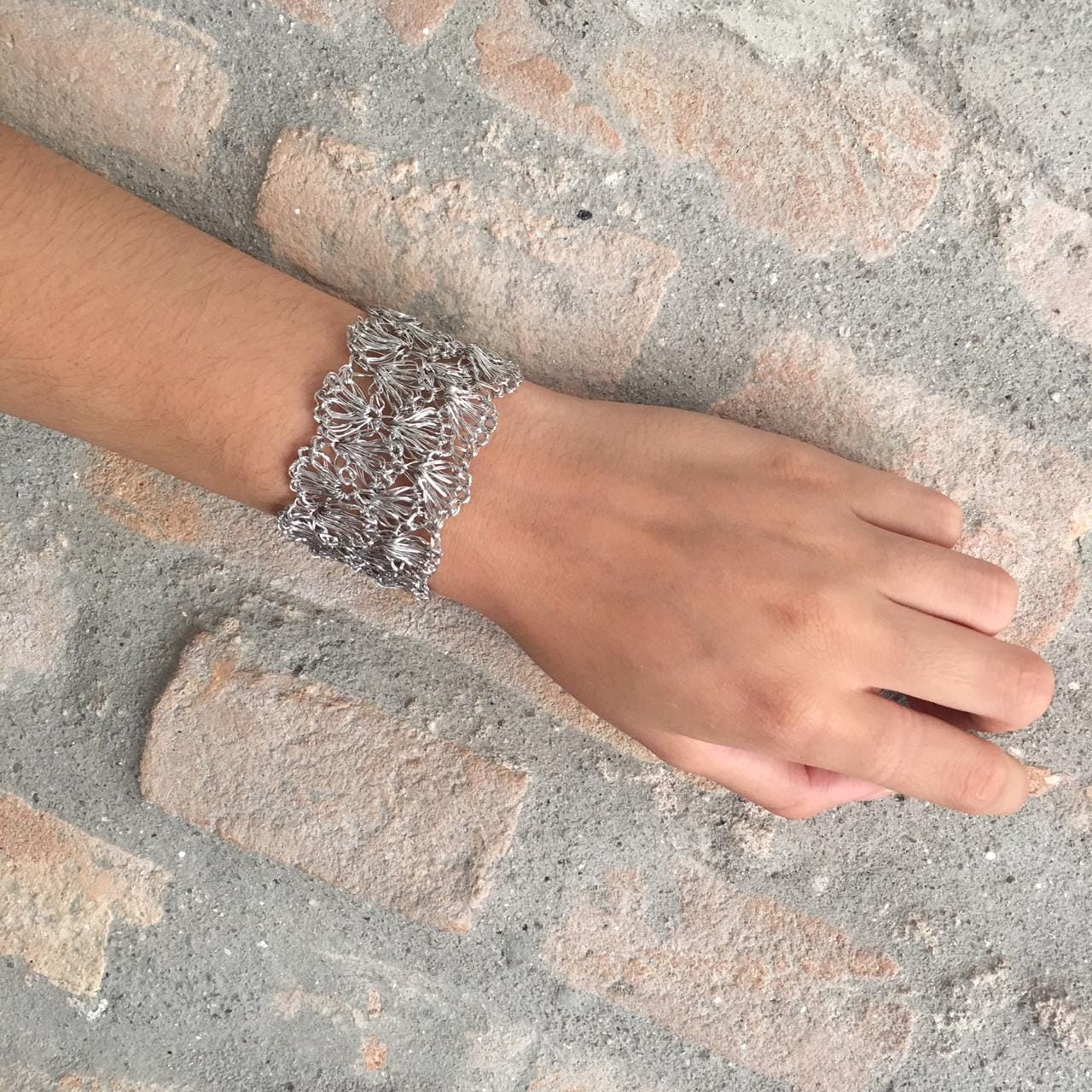 Hand-crocheted Palladium filled shell cuff bracelet handmade in Brazil, lightweight hypoallergenic nickel-free artisan jewelry with magnetic clasp.
