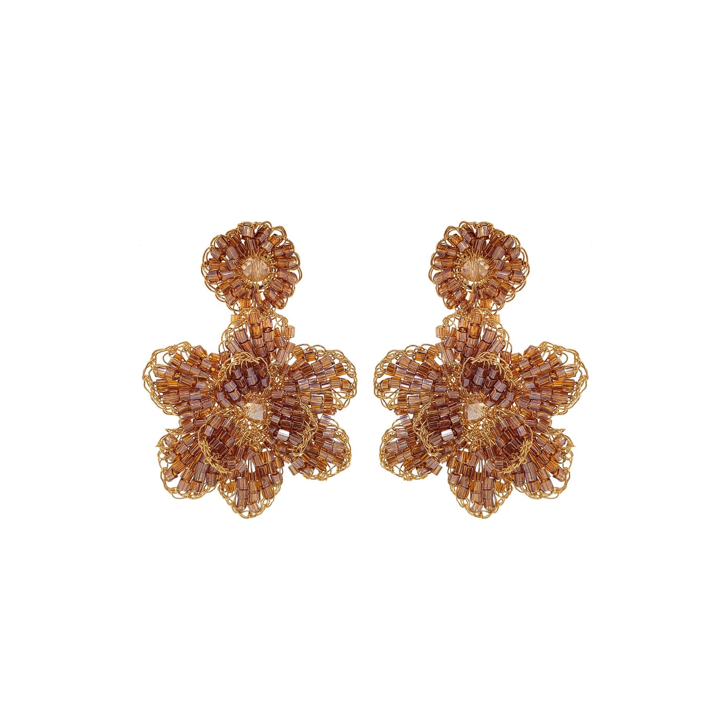 A pair of hand-crocheted earrings made with gold and amber colored yarn, designed in a floral pattern. Mini floral hand-crocheted earrings handmade in Brazil with 18 karat gold filled wire, lightweight artisan floral design, and delicate gold texture.