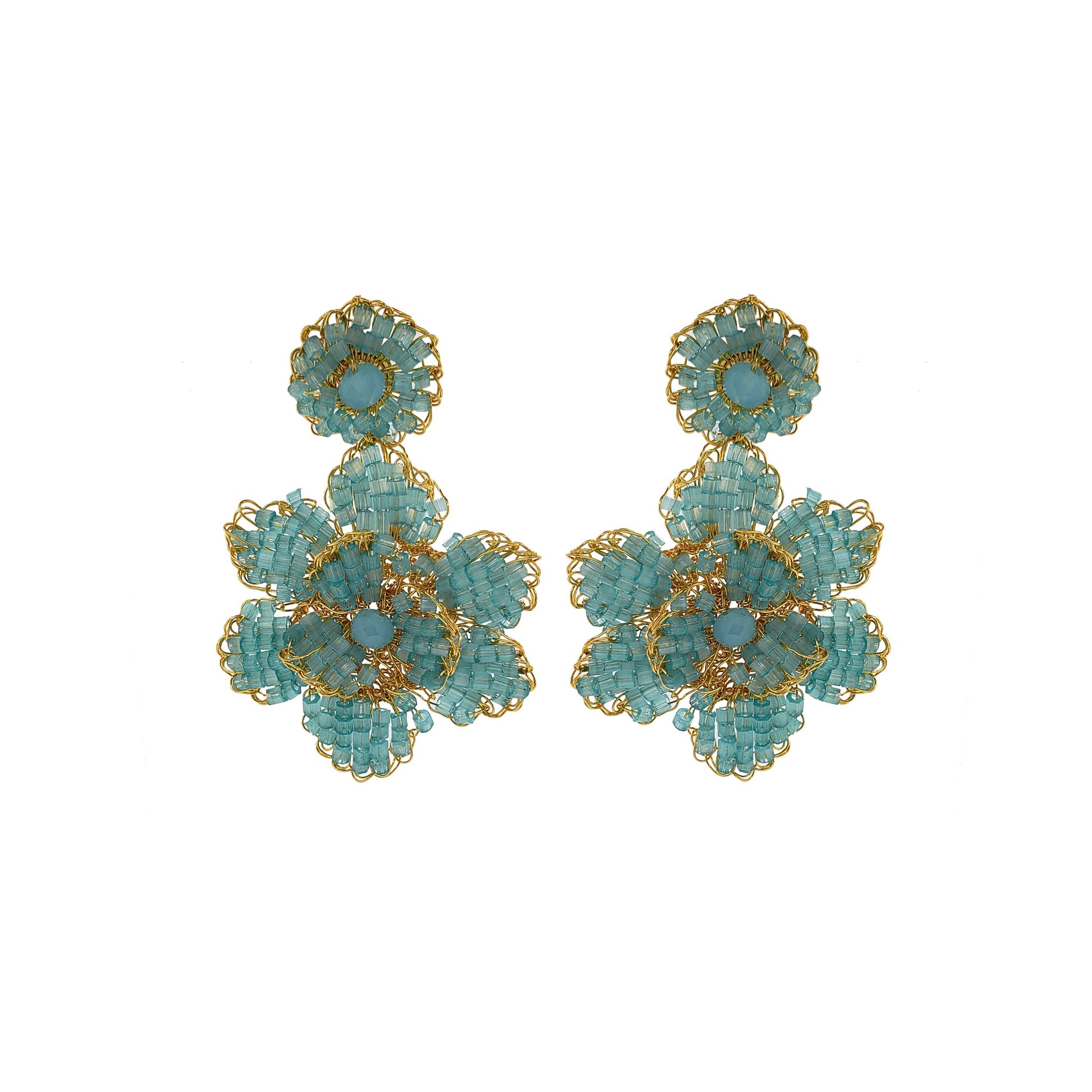 A pair of hand-crocheted earrings featuring blue and gold floral patterns, made with 18 karat gold filled wire. Mini floral hand crocheted earrings in 18 karat gold filled wire, lightweight hypoallergenic Brazilian artisan jewelry with feminine floral design.