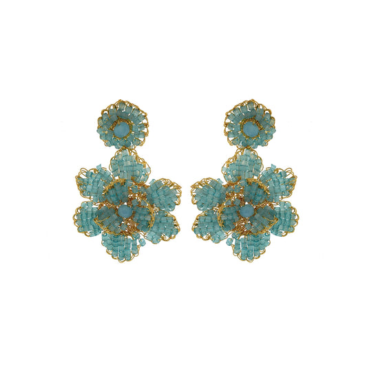 A pair of hand-crocheted earrings featuring blue and gold floral patterns, made with 18 karat gold filled wire. Mini floral hand crocheted earrings in 18 karat gold filled wire, lightweight hypoallergenic Brazilian artisan jewelry with feminine floral design.