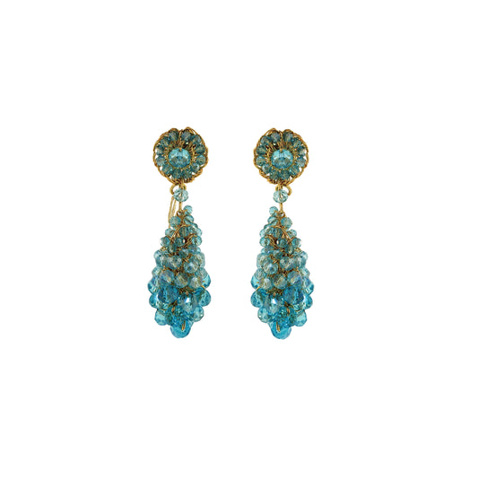 Pair of turquoise beaded earrings on a white background