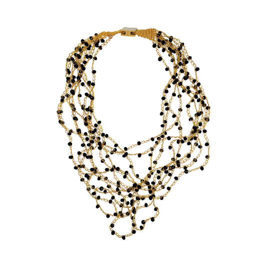 Layered multi-string hand-crocheted necklace handmade in Brazil with 18 karat gold filled wire, black bead accents, and a secure magnetic clasp.