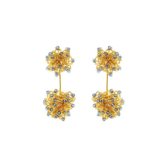 Pair of gold floral earrings with small stones on a white background. Hand-crocheted double mandala earrings made with 18 karat gold filled wire and colorful bead accents.