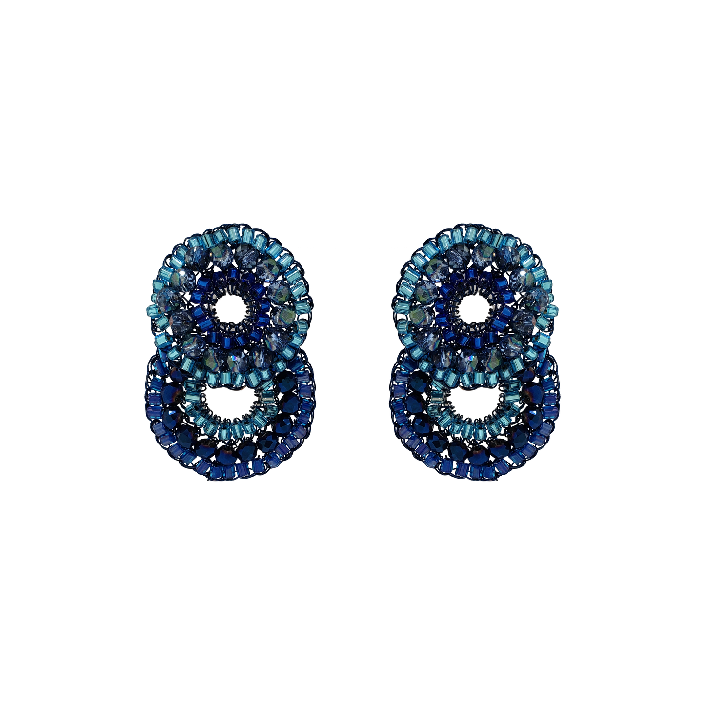A pair of small handmade crochet earrings featuring a double shaped cascade design with blue tones, shiny clear crystals, and enameled copper wire.