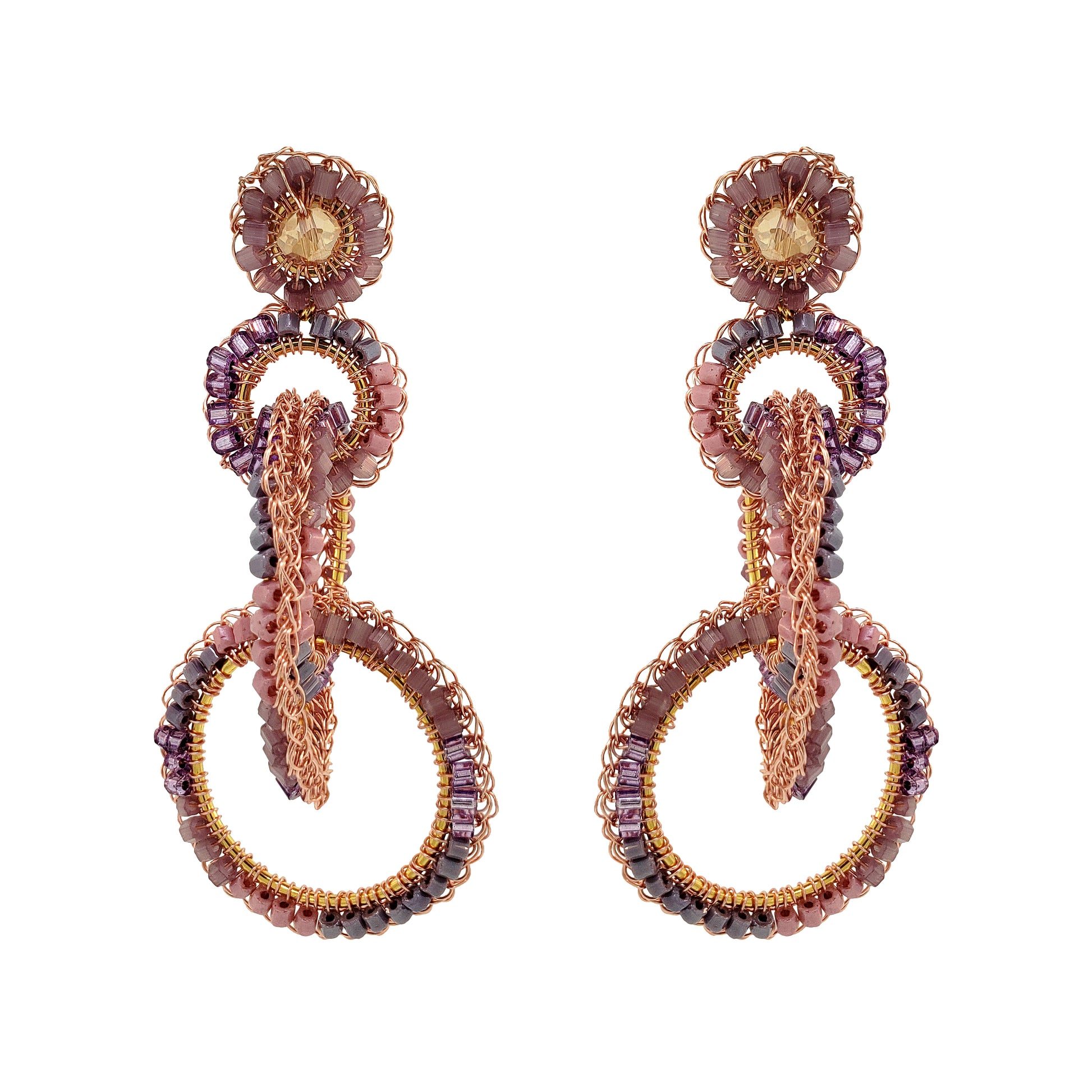 A pair of hand-crocheted earrings with 18 karat rose gold filled wire and multicolored beads and crystals. Interlocked link hand-crocheted earrings handmade in Brazil with 18 karat rose gold filled wire, blush, mauve, and lavender bead accents, sparkling crystals, and layered circular links.