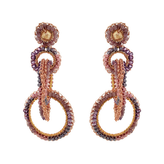 A pair of hand-crocheted earrings with 18 karat rose gold filled wire and multicolored beads and crystals. Interlocked link hand-crocheted earrings handmade in Brazil with 18 karat rose gold filled wire, blush, mauve, and lavender bead accents, sparkling crystals, and layered circular links.
