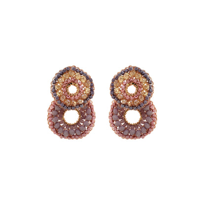 A pair of hand-crocheted round earrings with multicolored crystals and enameled copper wire details.