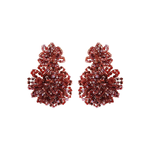 A pair of ornate, textured drop earrings made of faceted deep red crystals, arranged symmetrically on a solid white background. Shop Burgundy Mix Agnes Earrings, featuring dimensional hand-crocheted clusters and shimmering beads. Lightweight, hypoallergenic and handmade in Brazil.