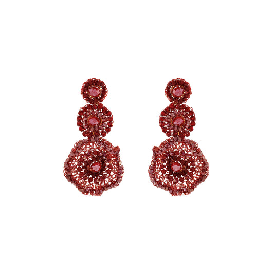 Red hand-crocheted triple drop statement earrings with layered circular design, sparkling bead accents, and enameled copper wire, handmade in Brazil.
