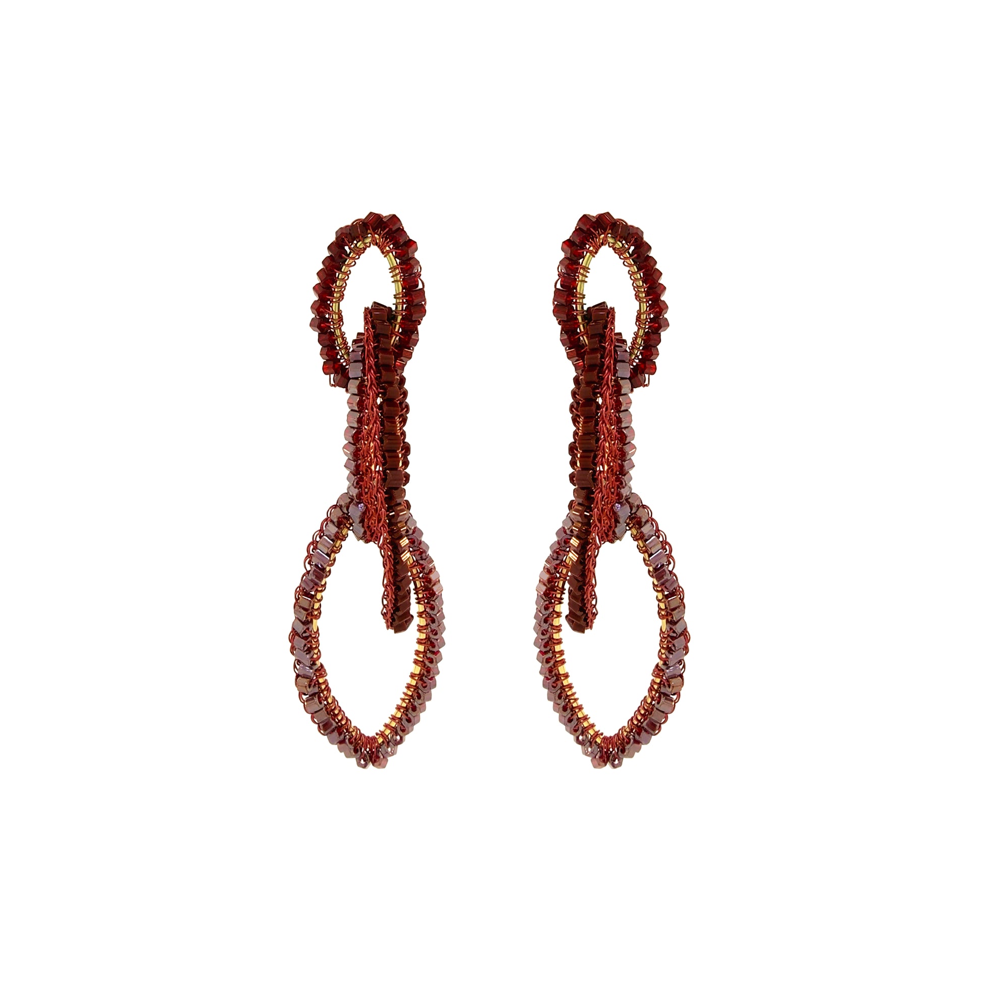 A pair of beaded drop earrings with a textured, looped design in deep red and brown tones, set against a plain white background. Shop the Burgundy Mix Demi Earrings, featuring three cascading hand-crocheted links with shimmering bead accents. Lightweight and handmade in Brazil.