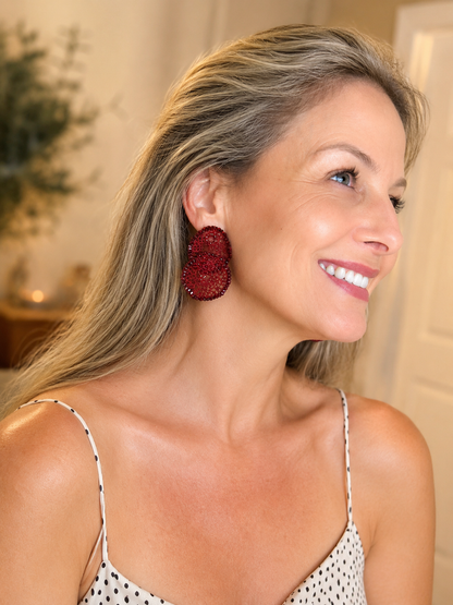 Hand-crocheted red statement earrings with layered circular design, sparkling bead accents, and enameled wire, handmade in Brazil. Hand-Crocheted Red Statement Earrings. Lightweight Artisan Earrings Made in Brazil