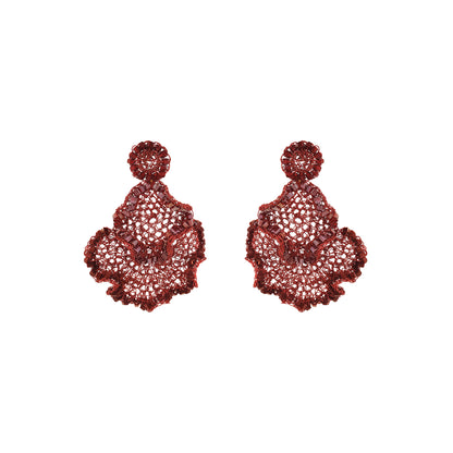 A pair of deep red lace-up statement earrings with intricate openwork detailing and scalloped edges, displayed on a solid white background. Burgundy Mix Jasmine Trio handmade crochet earrings with layered floral shapes, intricate enameled copper wire and shimmering bead accents.