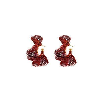 Pair of silver earrings with green gemstones on a white background. Burgundy Mix Nalu handmade crochet hoop earrings featuring rich burgundy enameled wire and 18K gold-filled details in a dimensional ruffled design.