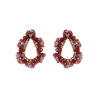 A pair of ornate teardrop-shaped earrings made of red wire mesh with small faceted beads in red, purple, and gold, displayed on a clean white background. Shop Burgundy Mix Nalu Teardrop Earrings, featuring ruffled hand-crocheted details and sparkling beads. Lightweight and handcrafted in Brazil. 
