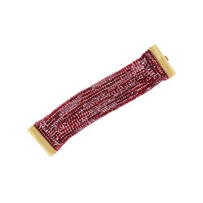 Red beaded bracelet with gold clasp on a white background. Handmade crochet cuff bracelet crafted in Brazil with shiny enameled wire, sparkling crystals, delicate beads, and magnetic clasp.