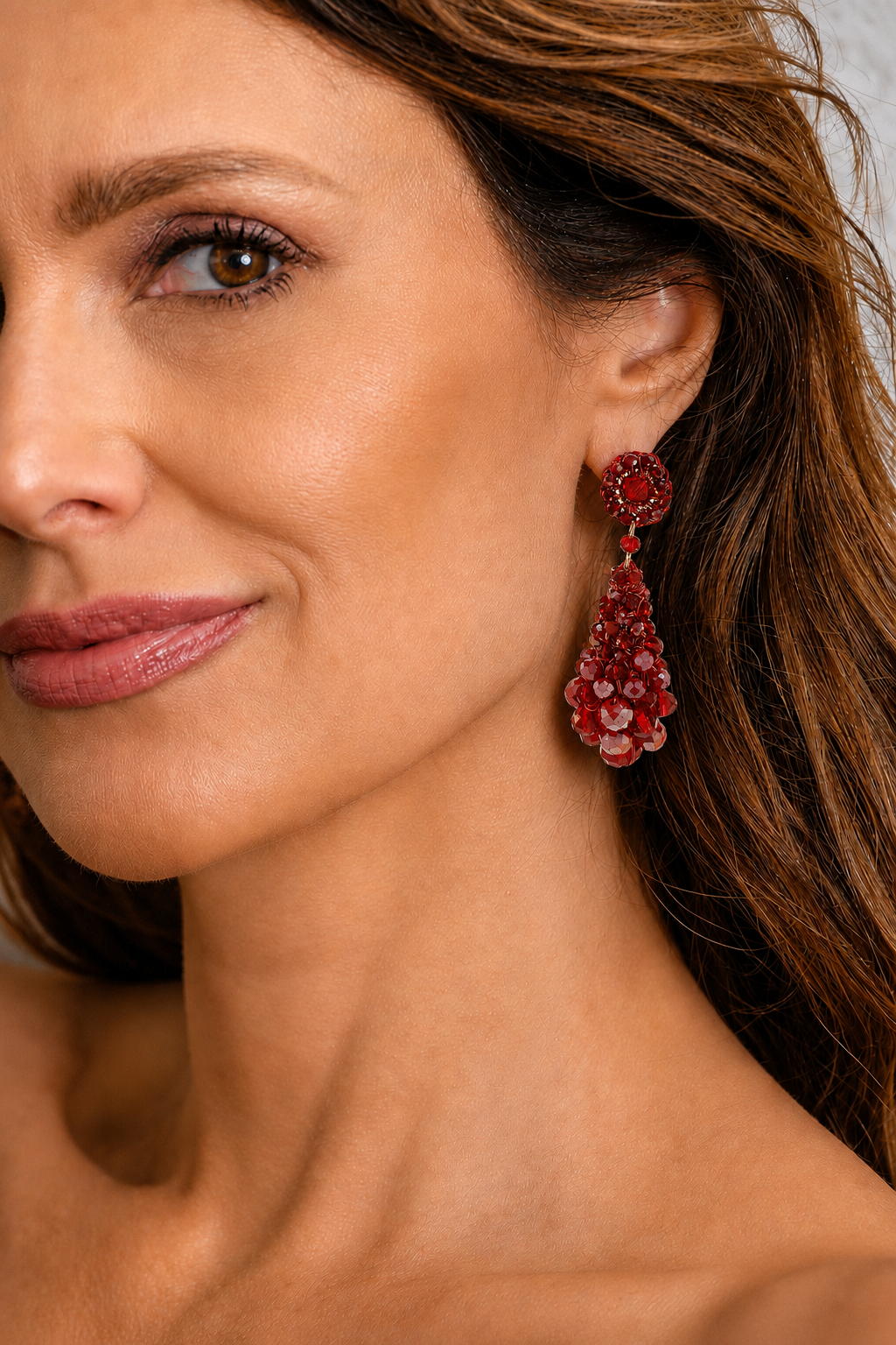 Hand-crocheted statement earrings made in Brazil with enameled copper wire and sparkling bead accents.