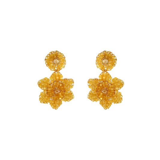Pair of yellow floral earrings on a white background. Mini floral hand-crocheted earrings handmade in Brazil with 18 karat gold filled wire and butter yellow bead accents.