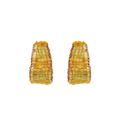 Pair of yellow beaded earrings on a white background