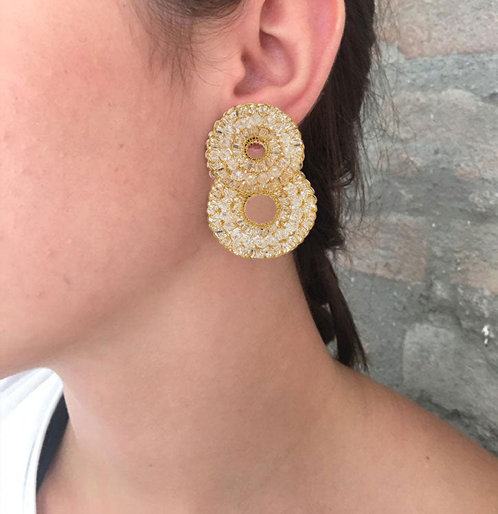 Crystal Clear and Gold hand-crocheted double-circle cascade earrings with gold wire, featuring turquoise, orange, yellow, burgundy, and red crystal beads, handmade in Brazil.