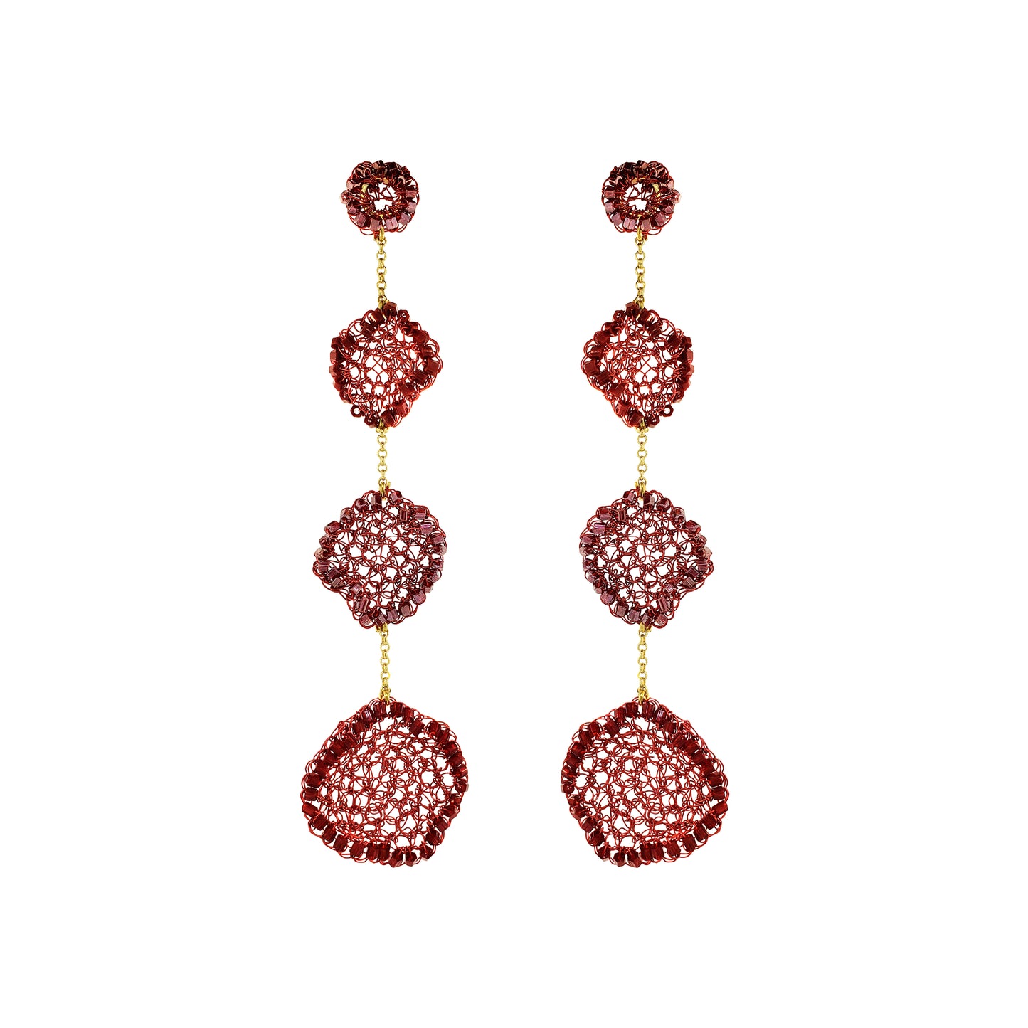 A pair of long drop earrings with three stacked textured circular segments in a deep red hue, separated by small gold chains, on a plain white background.