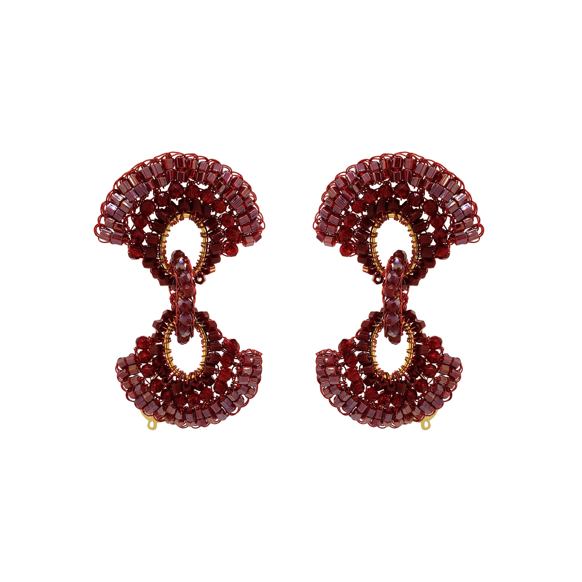 A pair of statement drop earrings crafted from faceted deep red gemstones and accented with gold-tone metal, shown against a plain white background. Red hand-crocheted Duo statement earrings with sparkling bead accents, fan-shaped details and a double-drop silhouette, handmade in Brazil.