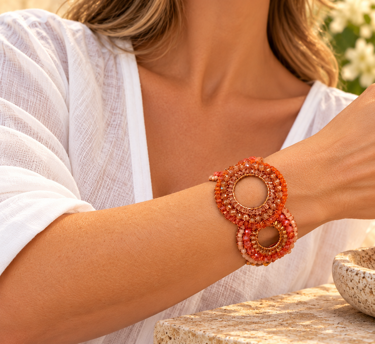 Discover the Flamme Mix Gush Bracelet, handcrafted in Brazil with 18k gold-filled wire, vibrant orange crystals, and intricate crochet circle designs.
