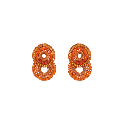 Flamme Mix Gush Small handmade crochet earrings featuring cascading circular designs with orange, amber, gold, and peach crystals woven in gold-filled wire.