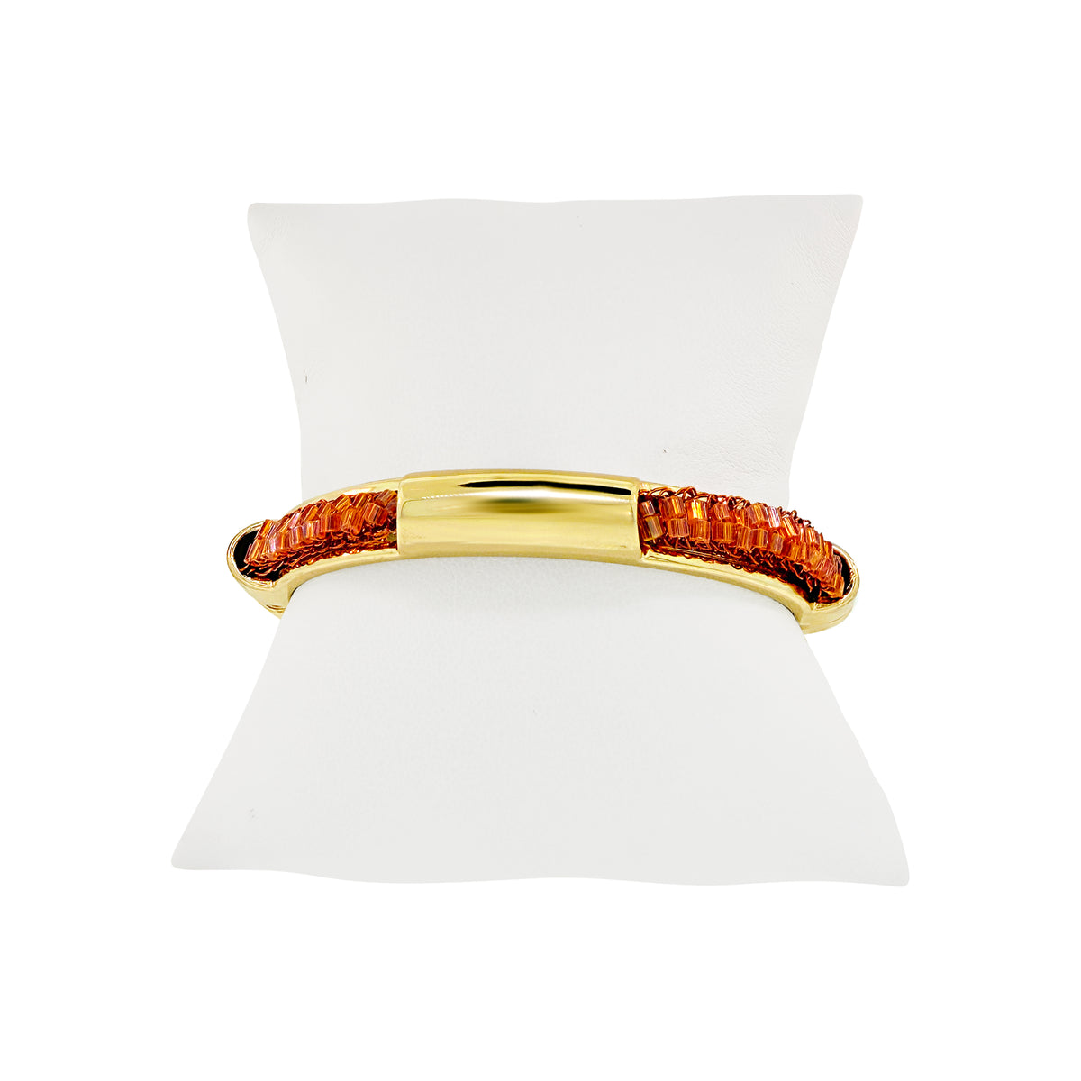 Shop the Flamme Mix Icon Bangle Bracelet, handcrafted in Brazil with vibrant orange crochet details, polished gold-tone accents, and a sleek, lightweight design.